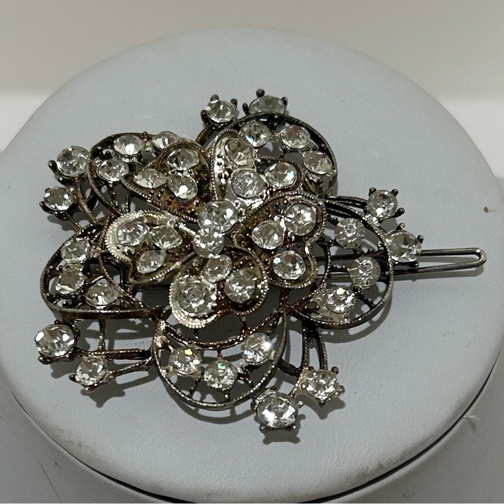 vintage-style floral hair barrette with rhinestones and filigree metal backing